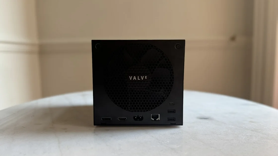 Steam Machine photograph showing the steam machine from behind on a marble circular table in front of a grey/beige wall