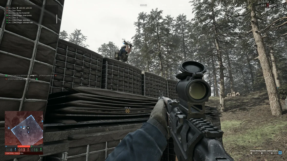 A Screenshot of Wardogs, showing the player watching another player build a structure with a hammer.