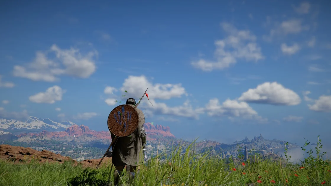 Crimson Desert screenshot showing Kliff, shield on back, looking over a grassy landscape and distant view of blue, faintly cloudy skies